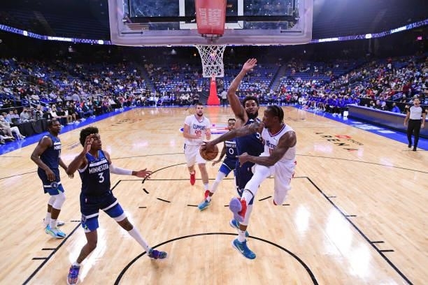 Eric Bledsoe of the LA Clippers drives to the basket and passes the ball during a preseason game against the Minnesota Timberwolves on October 11,...
