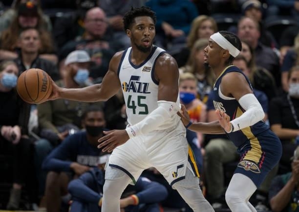 Donovan Mitchell of the Utah Jazz controls the ball against Devonte Graham of the New Orleans Pelicans during the second half of their game on...