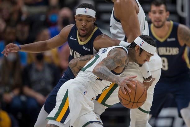 Davonte Graham of the New Orleans Pelicans pressures Jordan Clarkson of the Utah Jazz during the second half of their game on October 11, 2021 at the...