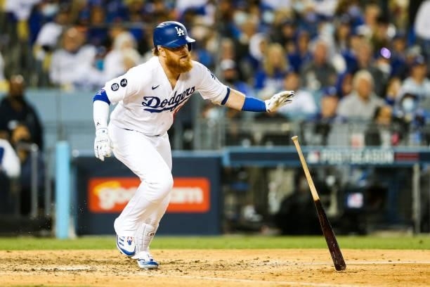 Justin Turner of the Los Angeles Dodgers singles in the sixth inning during Game 3 of the NLDS between the San Francisco Giants and the Los Angeles...