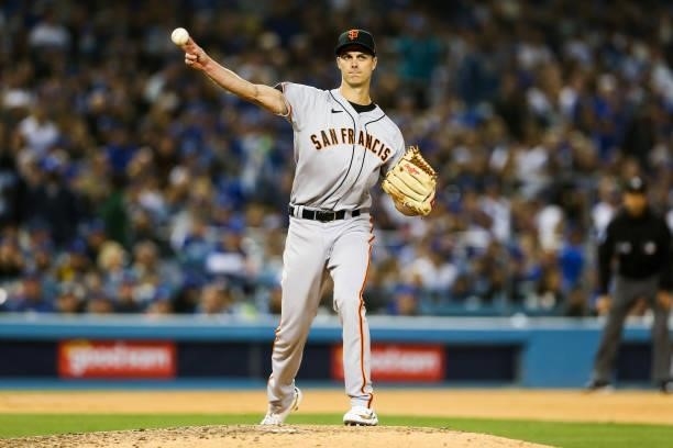 Tyler Rogers of the San Francisco Giants throws to first in the sixth inning during Game 3 of the NLDS between the San Francisco Giants and the Los...