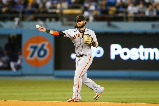 Brandon Crawford of the San Francisco Giants throws to first in the fifth inning during Game 3 of the NLDS between the San Francisco Giants and the...