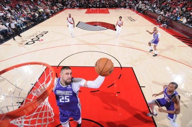 Alex Len of the Sacramento Kings rebounds the ball during a preseason game against the Portland Trail Blazers on October 11, 2021 at the Moda Center...