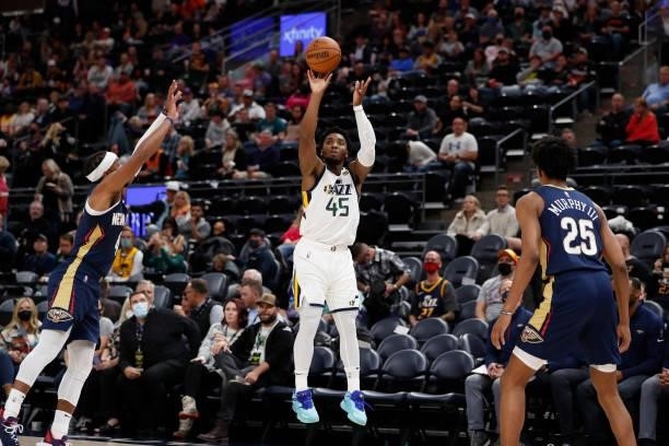 Donovan Mitchell of the Utah Jazz shoots a 3-pointer against the New Orleans Pelicans during a preseason game on October 11, 2021 at vivint.SmartHome...