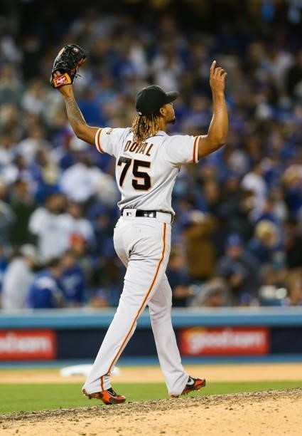 Camilo Doval of the San Francisco Giants reacts after closing out the game to beat the Los Angeles Dodgers 1-0 during Game 3 of the NLDS at Dodgers...