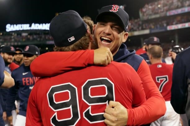 Members of the Boston Red Sox celebrate after the Red Sox defeated the Tampa Bay Rays 6-5 in Game 4 of the ALDS at Fenway Park on Monday, October 11,...