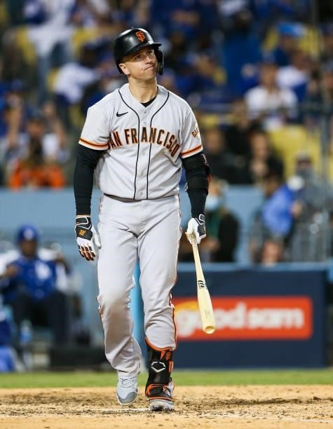 Buster Posey of the San Francisco Giants reacts after striking out during Game 3 of the NLDS between the San Francisco Giants and the Los Angeles...