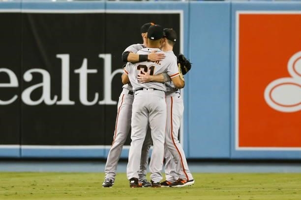 LaMonte Wade Jr. #31 of the San Francisco Giants, Mike Yastrzemski and Steven Duggar react after the final out beating the Los Angeles Dodgers 1-0...