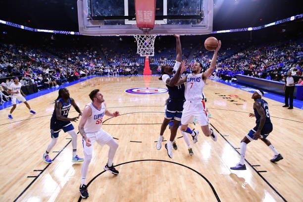 Amir Coffey of the LA Clippers drives to the basket during a preseason game against the Minnesota Timberwolves on October 11, 2021 at Toyota Arena in...