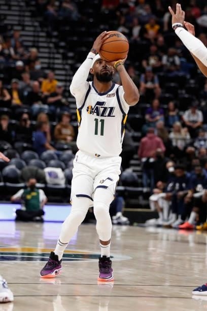 Mike Conley of the Utah Jazz shoots a 3-pointer against the New Orleans Pelicans during a preseason game on October 11, 2021 at vivint.SmartHome...