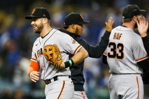 Evan Longoria of the San Francisco Giants reacts after beating the Los Angeles Dodgers 1-0 during Game 3 of the NLDS at Dodgers Stadium on Monday,...