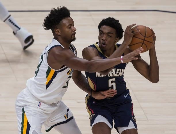 Herbert Jones of the New Orleans Pelicans is stopped by Elijah Hughes of the Utah Jazz during the second half of their game October 11, 2021 at the...