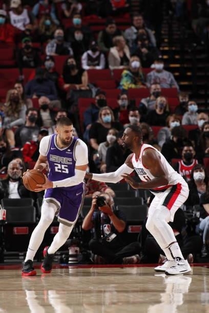 Alex Len of the Sacramento Kings handles the ball against the Portland Trail Blazers during a preseason game on October 11, 2021 at the Moda Center...