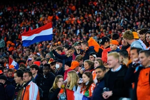 Fans with Dutch flag during the World Cup qualifier match between Netherlands and Gibraltar at Feyenoord Stadium de Kuip on October 11, 2021 in...
