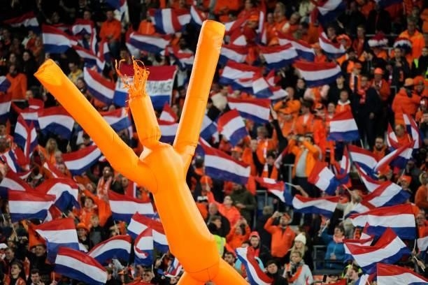 Inflatable cheer doll dances with fans and Dutch flags during the World Cup qualifier match between Netherlands and Gibraltar at Feyenoord Stadium de...