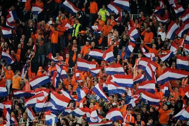 Fans with Dutch flags during the World Cup qualifier match between the Netherlands and Gibraltar at Feyenoord Stadium de Kuip on October 11, 2021 in...