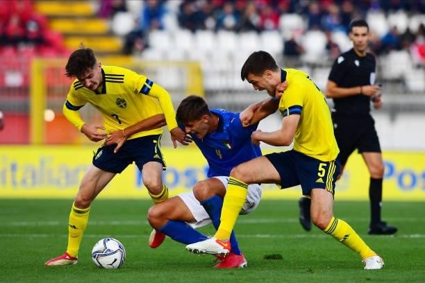 Jasper Tolinsson of Sweden, Lorenzo Lucca of Italy and Pavle Vagic of Sweden battle for the ball during the 2022 UEFA European Under-21 Championship...
