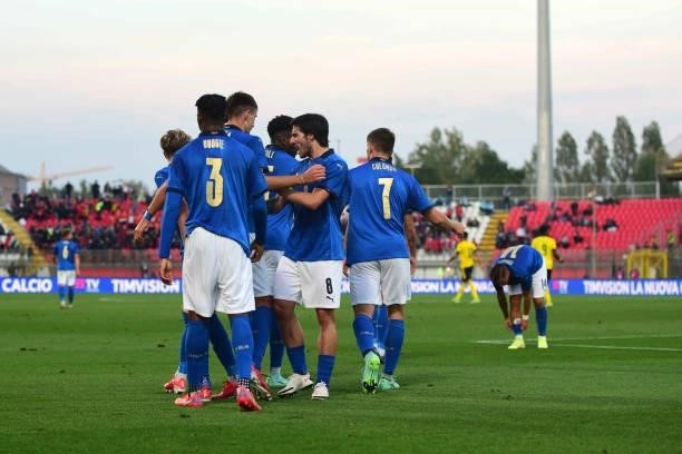 Lorenzo Lucca of Italy celebrates after scoring his team's first goal with teammates during the 2022 UEFA European Under-21 Championship Qualifier...
