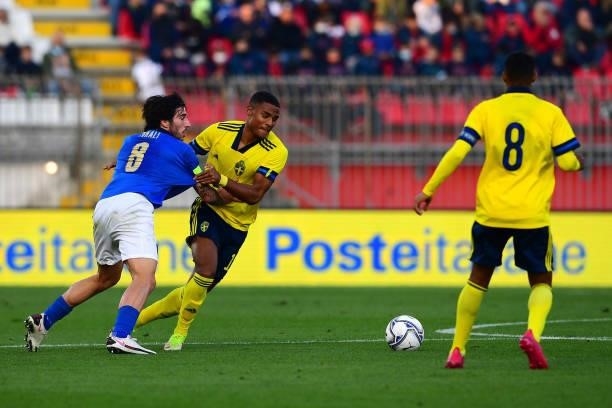 Sandro Tonali of Italy and Amir Sarr of Sweden battle for the ball during the 2022 UEFA European Under-21 Championship Qualifier match between Italy...