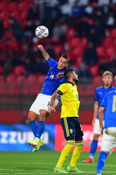 Salvatore Esposito of Italy and Tim Prica of Sweden battle for the ball during the 2022 UEFA European Under-21 Championship Qualifier match between...