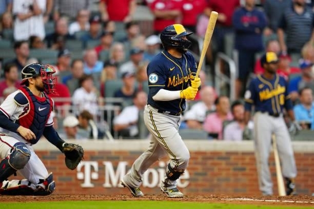 Omar Narváez of the Milwaukee Brewers hits an RBI single in the top of the fourth inning during Game 4 of the NLDS between the Milwaukee Brewers and...