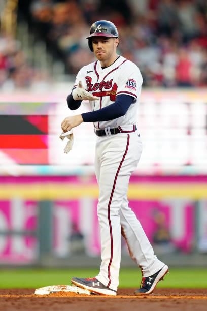 Freddie Freeman of the Atlanta Braves stands on second base after hitting a double in the bottom of the third inning during Game 4 of the NLDS...