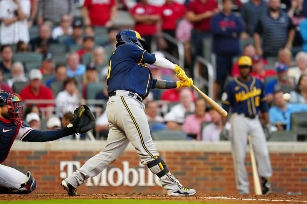 Omar Narváez of the Milwaukee Brewers hits an RBI single in the top of the fourth inning during Game 4 of the NLDS between the Milwaukee Brewers and...