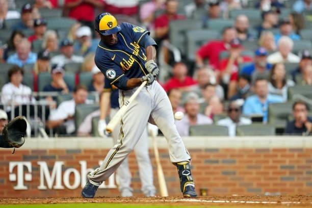 Lorenzo Cain of the Milwaukee Brewers hits an RBI single in the top of the fourth inning during Game 4 of the NLDS between the Milwaukee Brewers and...