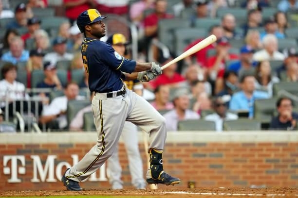 Lorenzo Cain of the Milwaukee Brewers hits an RBI single in the top of the fourth inning during Game 4 of the NLDS between the Milwaukee Brewers and...