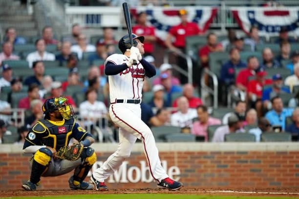 Freddie Freeman of the Atlanta Braves hits a double in the bottom of the third inning during Game 4 of the NLDS between the Milwaukee Brewers and the...