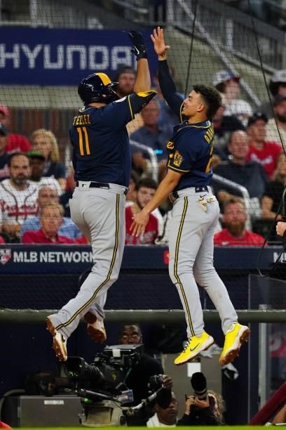 Rowdy Tellez of the Milwaukee Brewers celebrates with Avisaíl García after hitting a two-run home run in the top of the fifth inning during Game 4 of...