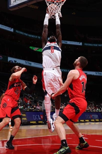 Montrezl Harrell of the Washington Wizards dunks the ball during a preseason game against the Toronto Raptors on October 12, 2021 at Capital One...