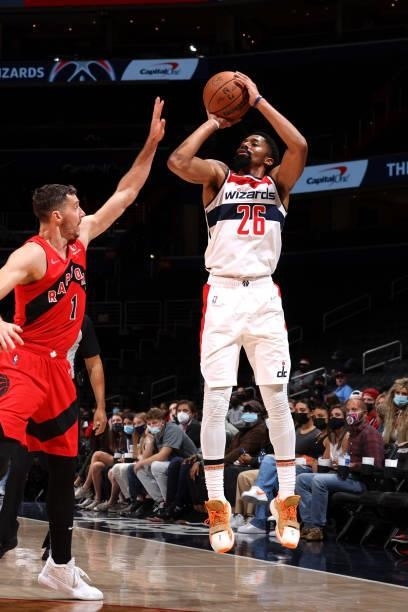 Spencer Dinwiddie of the Washington Wizards shoots a three point basket during a preseason game against the Toronto Raptors on October 12, 2021 at...