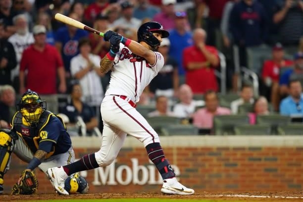 Eddie Rosario of the Atlanta Braves hits a two-run single in the bottom of the fourth inning during Game 4 of the NLDS between the Milwaukee Brewers...