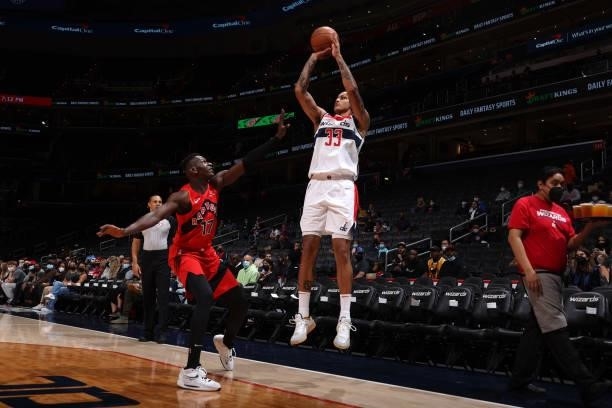 Kyle Kuzma of the Washington Wizards shoots a three point basket during a preseason game against the Toronto Raptors on October 12, 2021 at Capital...