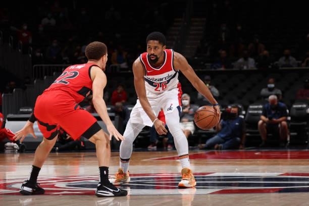 Malachi Flynn of the Toronto Raptors plays defense on Spencer Dinwiddie of the Washington Wizards during a preseason game on October 12, 2021 at...