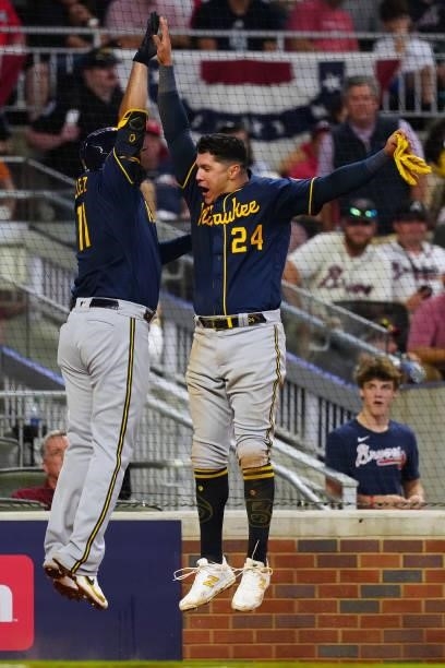 Rowdy Tellez of the Milwaukee Brewers celebrates with Avisaíl García after hitting a two-run home run in the top of the fifth inning during Game 4 of...