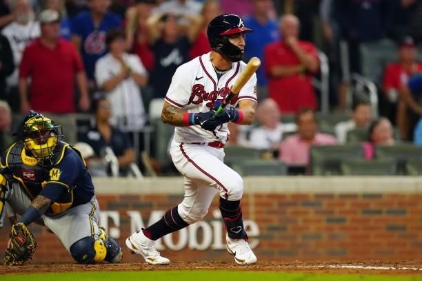 Eddie Rosario of the Atlanta Braves hits a two-run single in the bottom of the fourth inning during Game 4 of the NLDS between the Milwaukee Brewers...