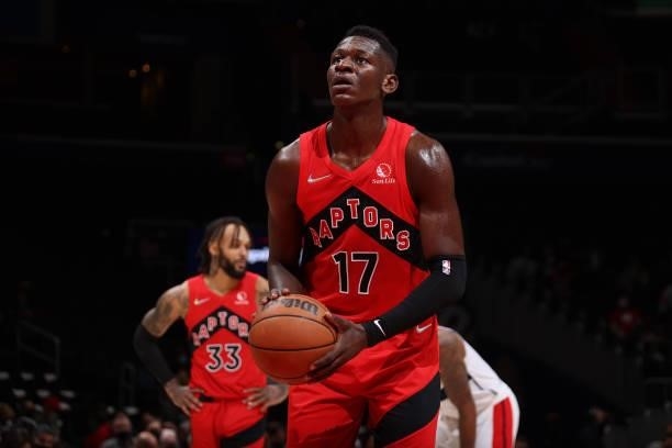 Isaac Bonga of the Toronto Raptors plays defense during a preseason game against the Washington Wizards on October 12, 2021 at Capital One Arena in...