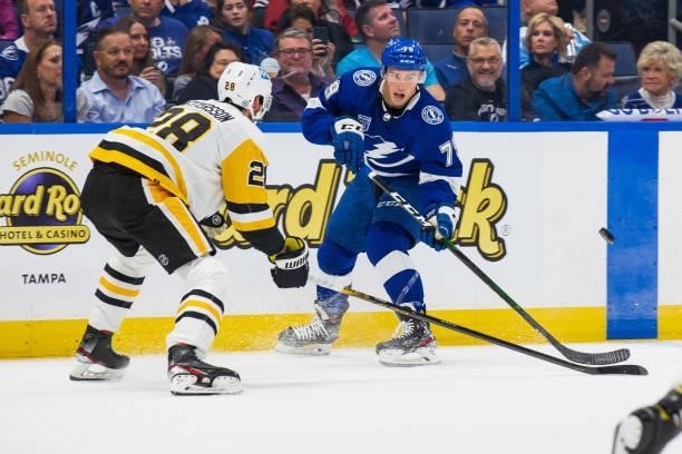 Ross Colton of the Tampa Bay Lightning skates against Marcus Pettersson of the Pittsburgh Penguins during the first period at Amalie Arena on October...