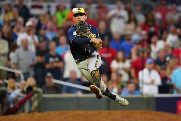 Luis Urías of the Milwaukee Brewers throws to first base in the bottom of the sixth inning during Game 4 of the NLDS between the Milwaukee Brewers...