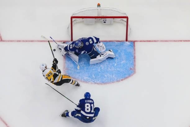 Goalie Andrei Vasilevskiy of the Tampa Bay Lightning makes a save against Dominik Simon of the Pittsburgh Penguins during the first period at Amalie...