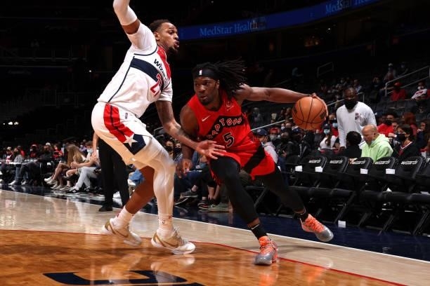 Precious Achiuwa of the Toronto Raptors drives to the basket during a preseason game against the Washington Wizards on October 12, 2021 at Capital...