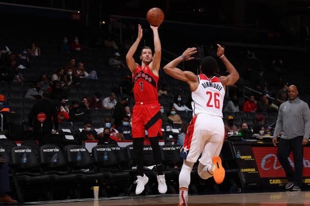 Goran Dragic of the Toronto Raptors shoots a three point basket during a preseason game against the Washington Wizards on October 12, 2021 at Capital...