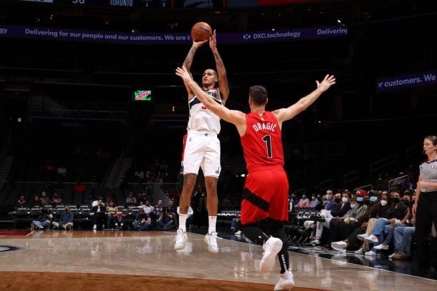 Kyle Kuzma of the Washington Wizards shoots a three point basket during a preseason game against the Toronto Raptors on October 12, 2021 at Capital...