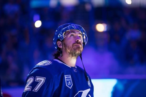 Ryan McDonagh of the Tampa Bay Lightning watches the Stanley Cup Champions banner as it is lifted to the rafters before the game against the...