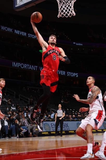Sam Dekker of the Toronto Raptors dunks the ball during a preseason game against the Washington Wizards on October 12, 2021 at Capital One Arena in...