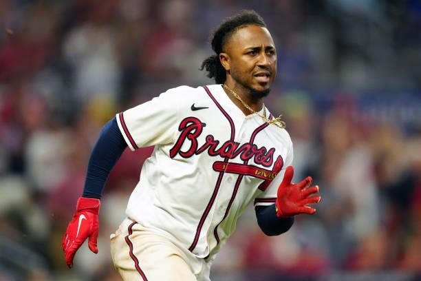 Ozzie Albies of the Atlanta Braves runs to first base after hitting a single in the bottom of the sixth inning during Game 4 of the NLDS between the...