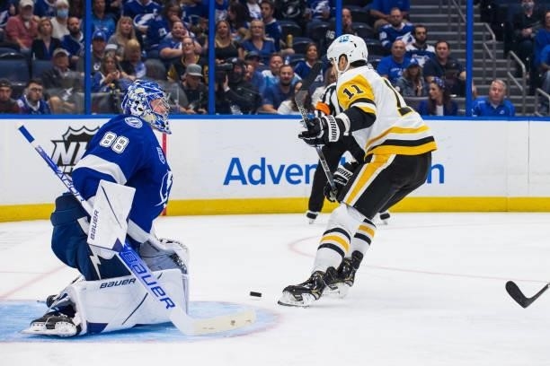 Brian Boyle of the Pittsburgh Penguins shoots the puck for a goal against goalie Andrei Vasilevskiy of the Tampa Bay Lightning during the second...