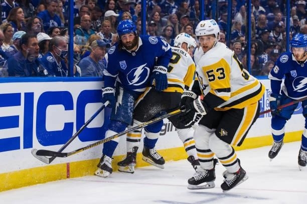 Pat Maroon of the Tampa Bay Lightning skates against Teddy Blueger of the Pittsburgh Penguins during the first period at Amalie Arena on October 12,...